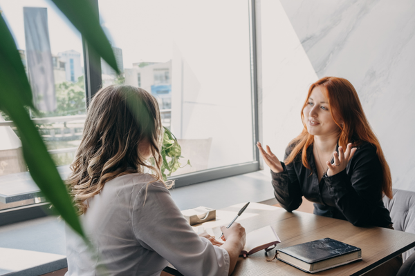 Travel advisor consulting with client in person as part of lead nurturing and conversion process