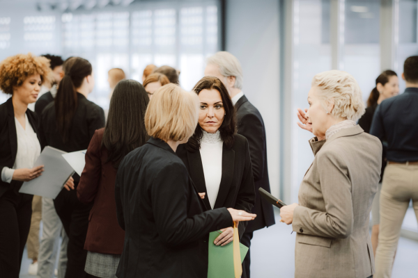 Travel professionals networking and discussing business at a corporate event or travel conference gathering