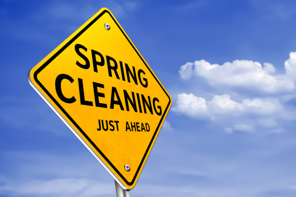 Spring cleaning tips for travel advisors concept with road sign indicating business reset and growth