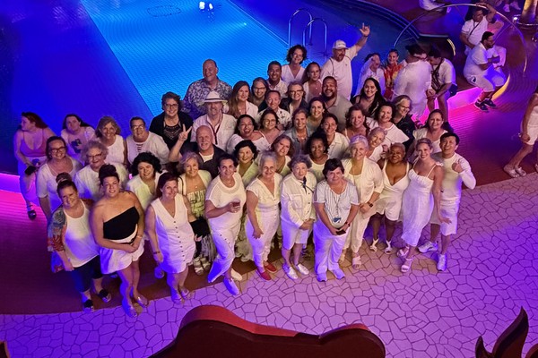 Travel advisors attending a hands-on training workshop with laptops at an OutsideAgents.com Seminar at Sea