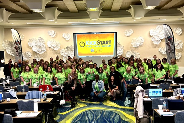 OutsideAgents.com KickStart Back to Basics Bootcamp attendees in matching green shirts at a training event