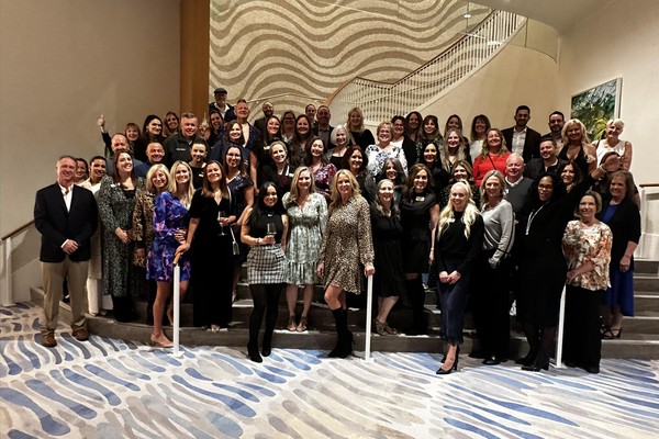 OutsideAgents.com travel advisors posing for a group photo at the Opulence networking gala event