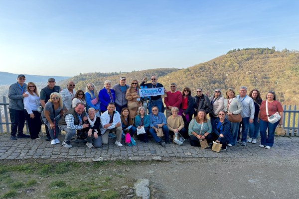 Group of Dream Vacations franchise owners gathered at a Rhine River viewpoint in Germany during a Dream Vacations event