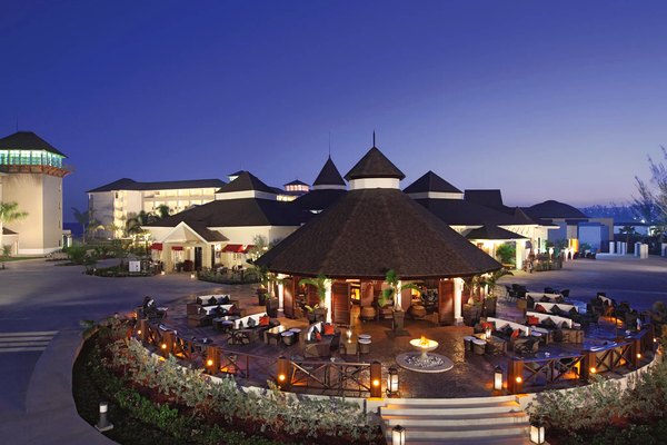 Resort promenade and lounge at twilight at Secrets St. James