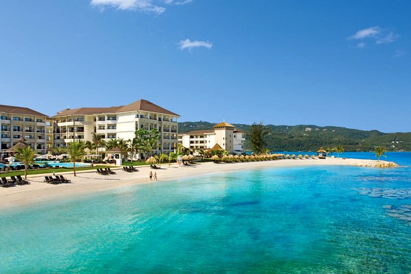 Beach and turquoise water at Secrets Wild Orchid Montego Bay
