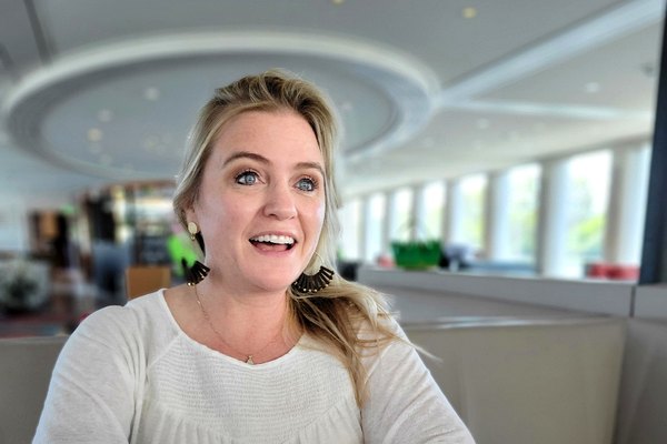 Travel advisor smiling at her laptop during a mid-year business review