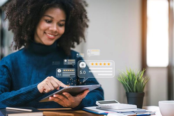 Luxury travel client leaving a five-star review on a tablet