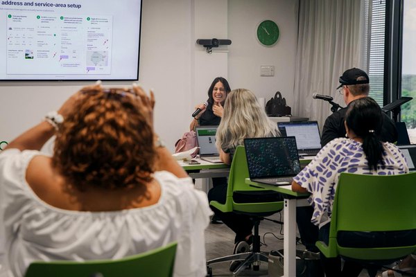 Cruise Planners Franchise Owners during Tech Days at the Home Office, following along with hands-on training inside CP Maxx.