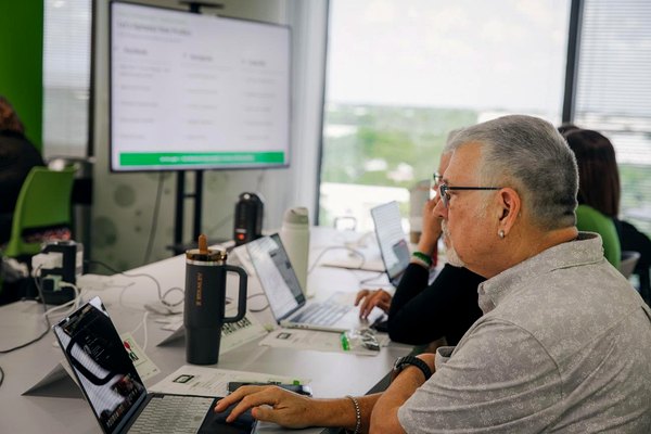 Cruise Planners Franchise Owners during a live Tech Days training session at the Home Office, taking part in open discussions, exploring new technology, and learning through real-time Q&A.